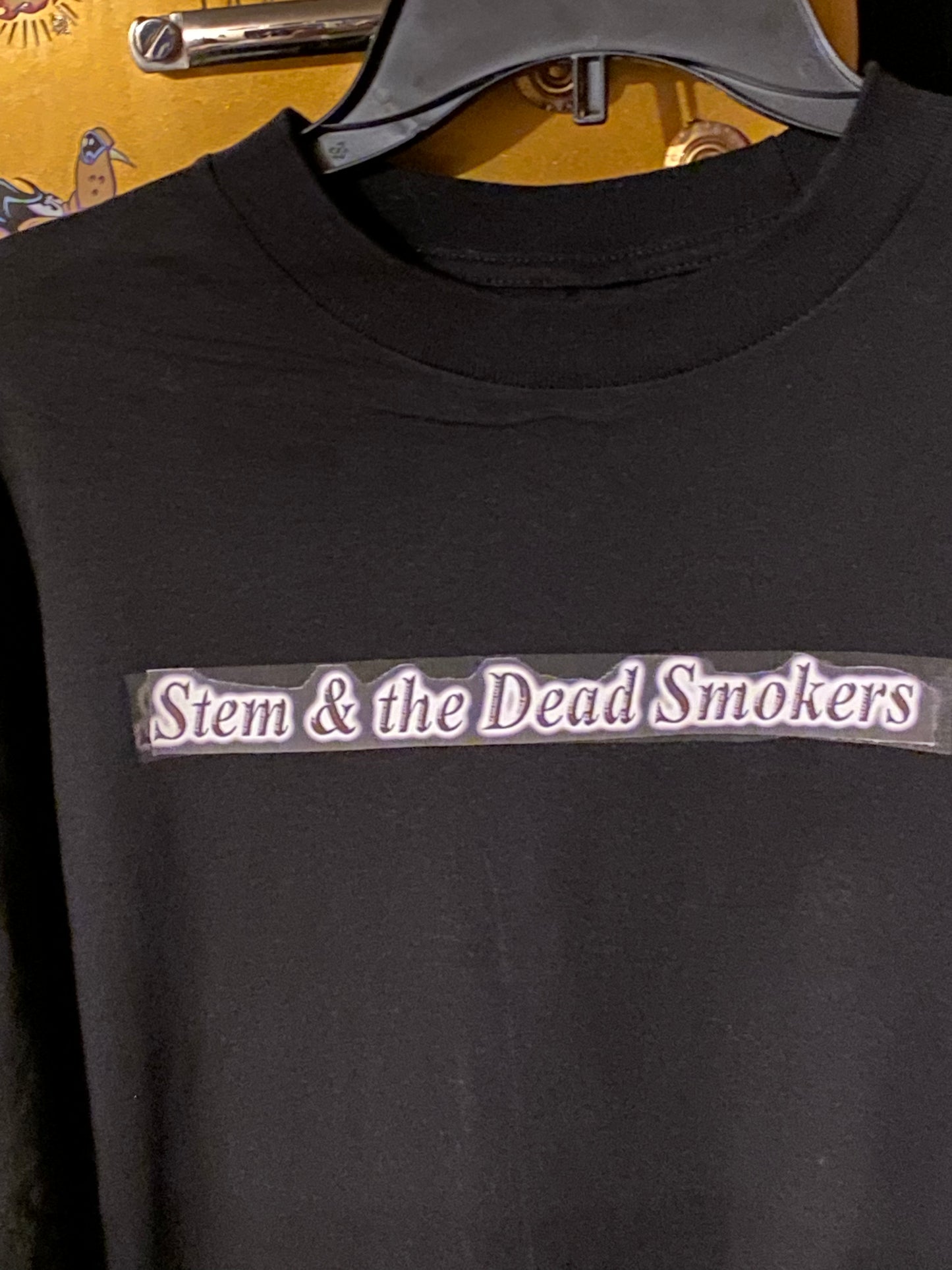 Stem & the Dead Smokers band script across the front
